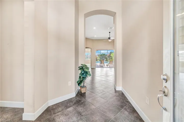 Hall with tile patterned floors