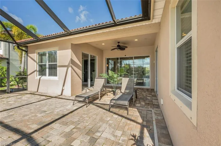 View of patio / terrace with ceiling fan and glass enclosure