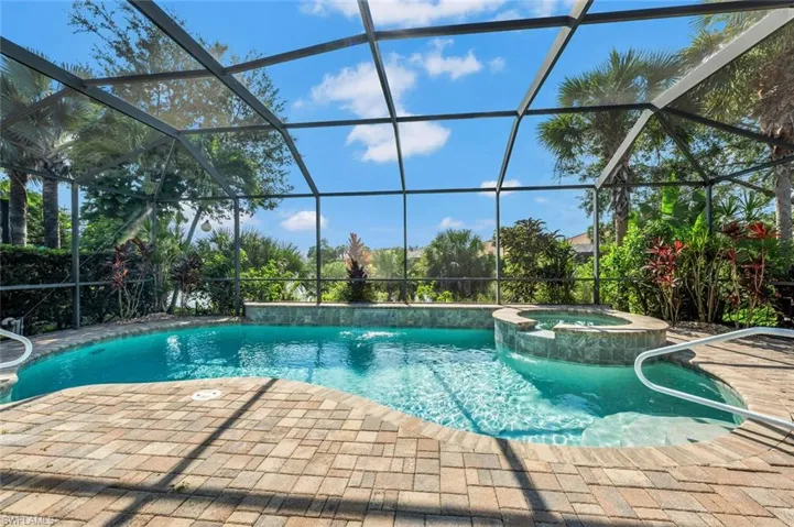View of pool featuring an in ground hot tub, a lanai, and a patio area