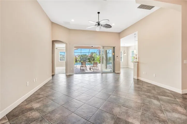 Spare room featuring tile patterned floors and ceiling fan