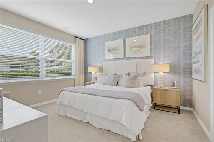 Bedroom featuring carpet floors, wallpapered walls, and recessed lighting