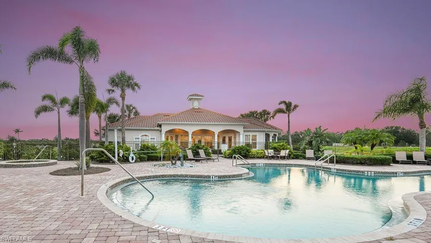 Community pool with a patio