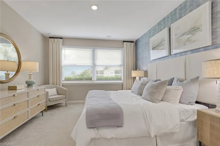 Carpeted bedroom featuring baseboards and recessed lighting