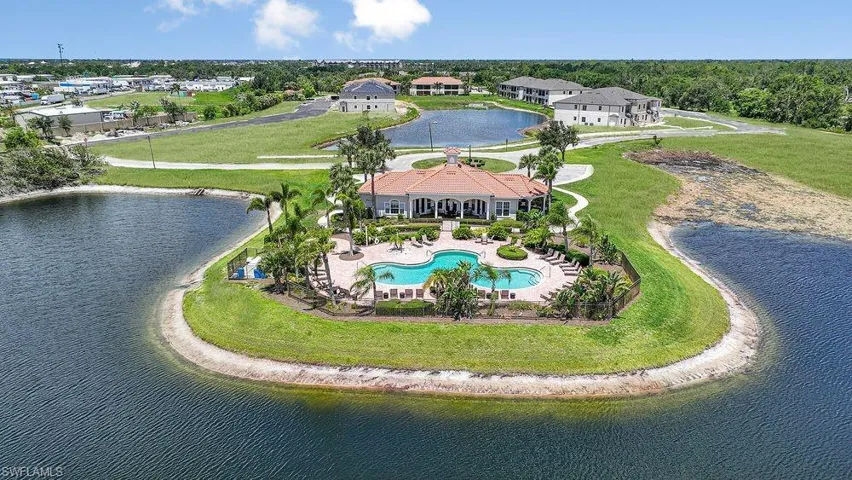 Bird's eye view of a pool area and a large body of water