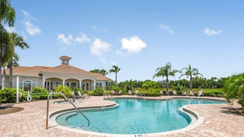 Community pool with a patio area