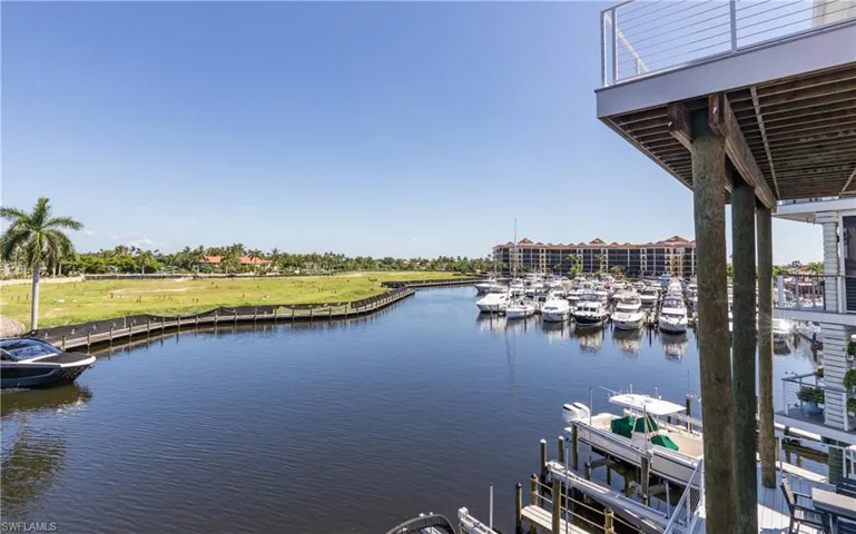 Level-3 view from the primary bedroom balcony. Waterfront property, marina, and gulf access.