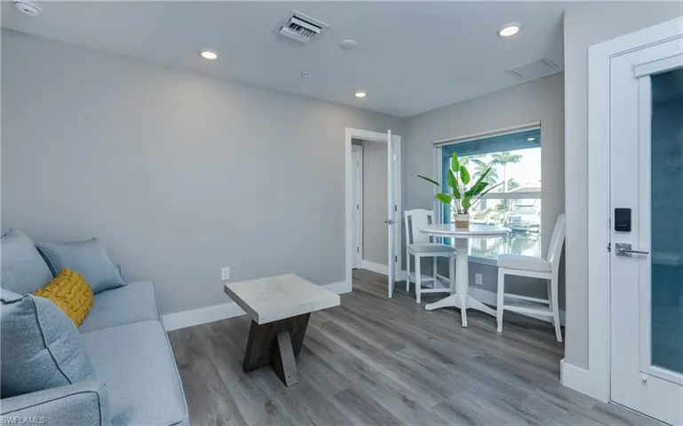 On the 1st level, Private Guest Suite with full bath and rear entrance from dock.