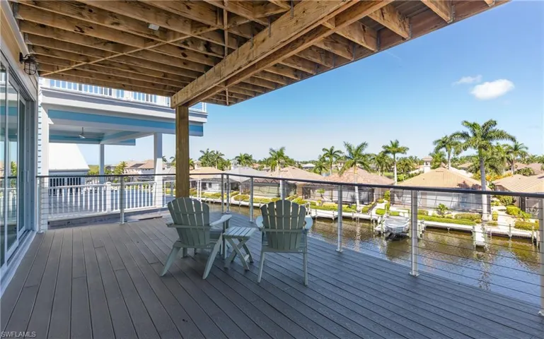 Level-3 Primary bedroom with spacious outdoor deck with composite decking, cable railing, and a covered ceiling