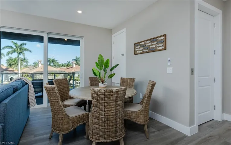 Dining room with sliding glass doors to the 2nd-level balcony.