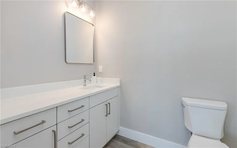 Level-3 Primary Bathroom. White vanity with integrated sink and white countertop