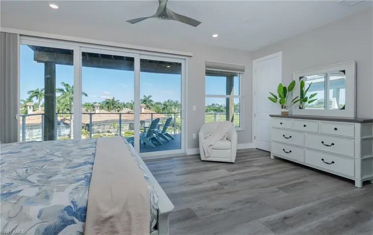 Level-3 Primary bedroom. Room featuring a ceiling fan, recessed lighting, and a sliding glass door opening to an outdoor balcony.