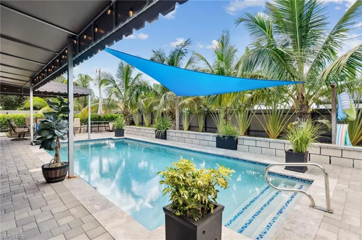 View of pool with a fenced in pool, fence private yard, and a patio area