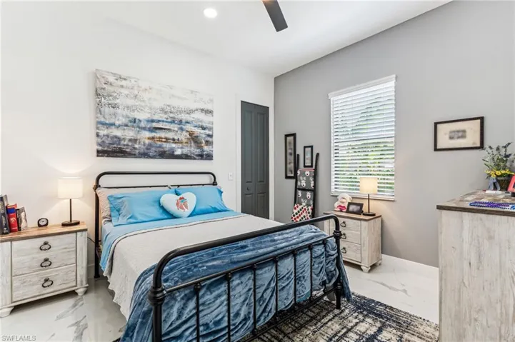 Bedroom with marble finish floor, baseboards, ceiling fan, and recessed lighting