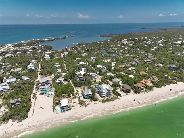 Bird's eye view featuring a view of the beach and a water view