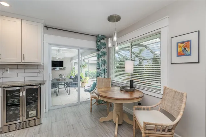 Dining room featuring indoor bar and beverage cooler