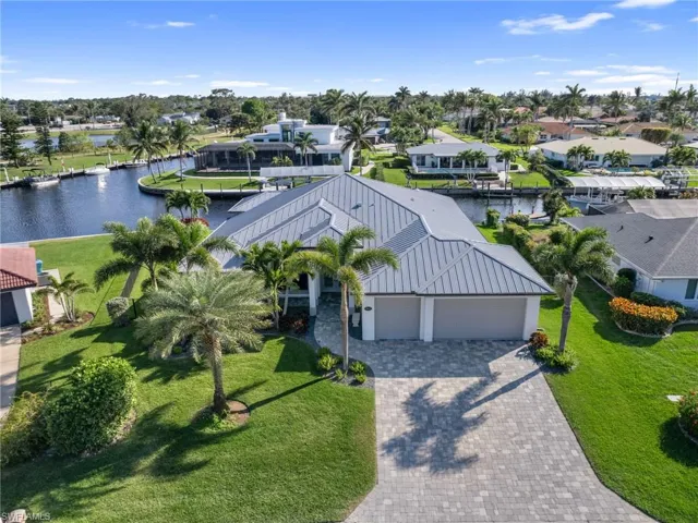 Aerial view featuring a water view and a residential view