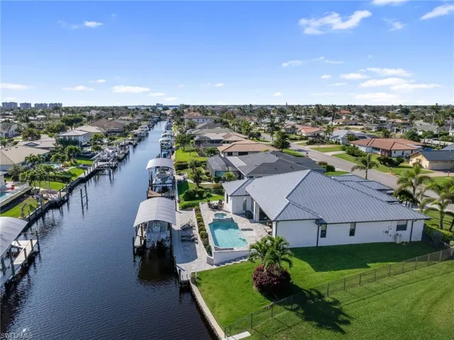 Drone / aerial view featuring a water view and a residential view