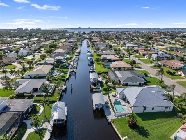 Bird's eye view with a water view and a residential view
