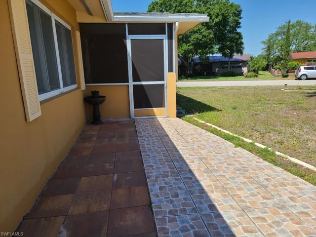View of patio / terrace featuring a sunroom