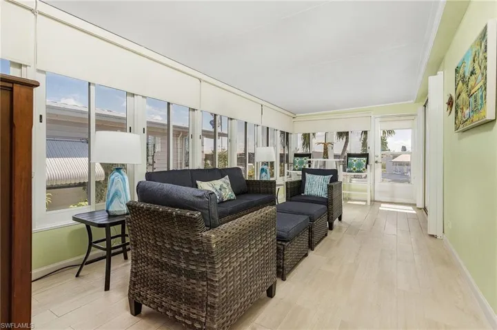 Sunroom featuring an outdoor living space and a healthy amount of sunlight