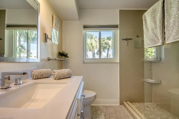 Bathroom with a stall shower and vanity