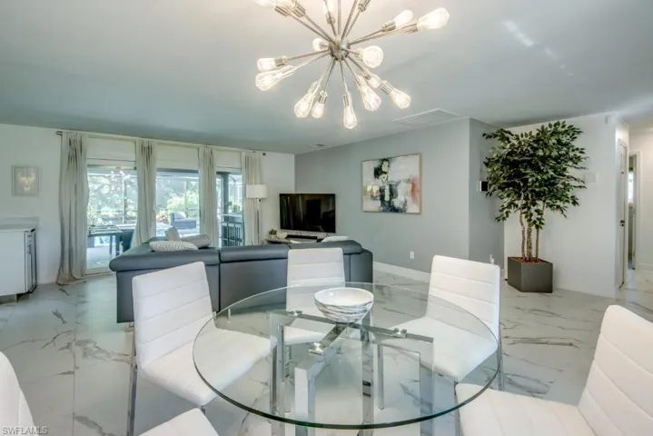 Dining area featuring suspended lighting and baseboards