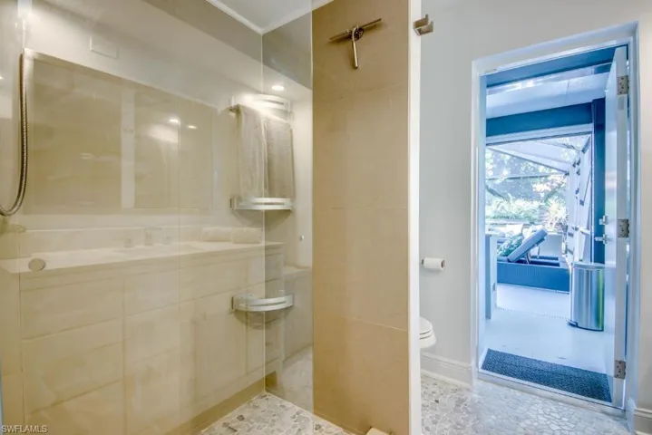 Bathroom featuring a walk in shower and toilet