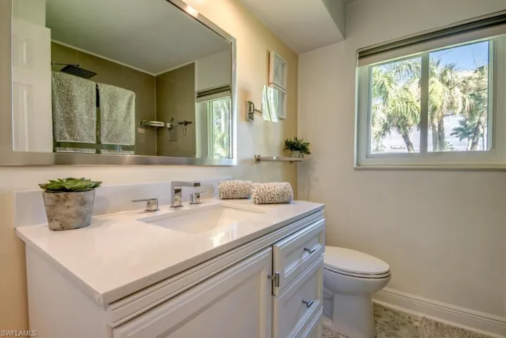 Bathroom with vanity and a shower