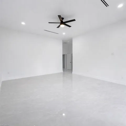 Spare room with ceiling fan and recessed lighting