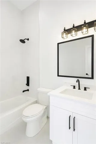 Bathroom featuring shower / bathtub combination and vanity