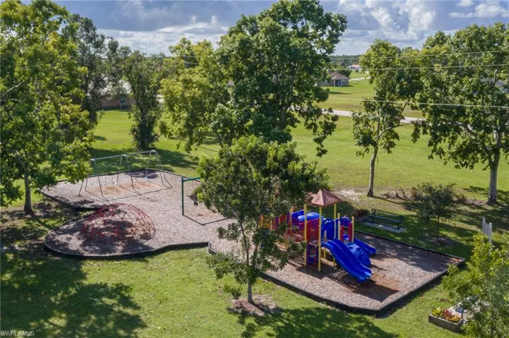 View of play area with a lawn