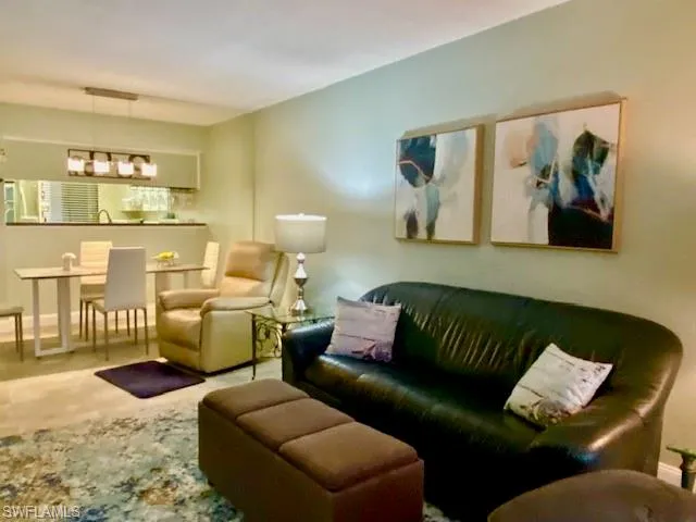 Living room featuring baseboards