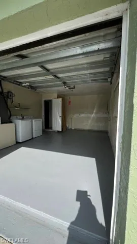 Spacious garage featuring a durable gray floor coating