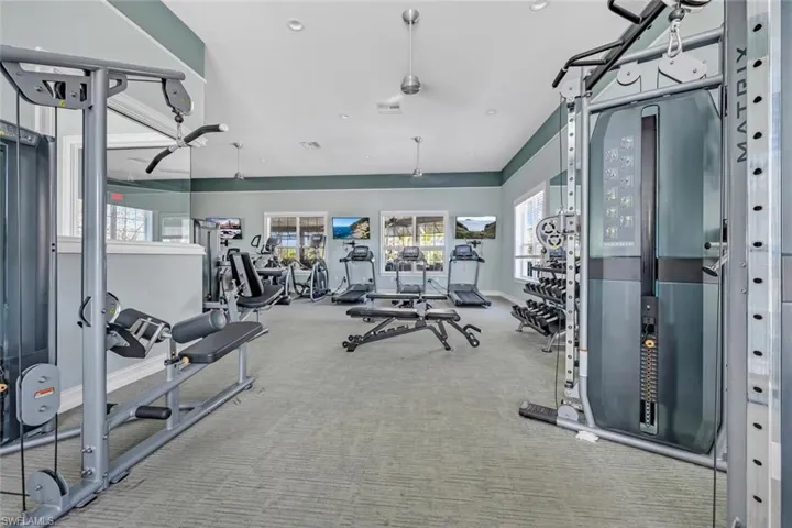 Workout area featuring recessed lighting