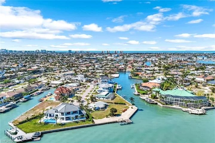 Birds eye view of property with a residential view and a water view