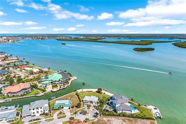 Aerial view featuring a residential view and a water view