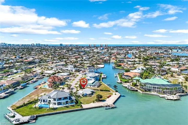 Drone / aerial view featuring a water view and a residential view