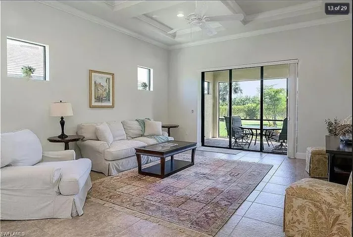 Bright and inviting living area with large windows and direct lanai access.