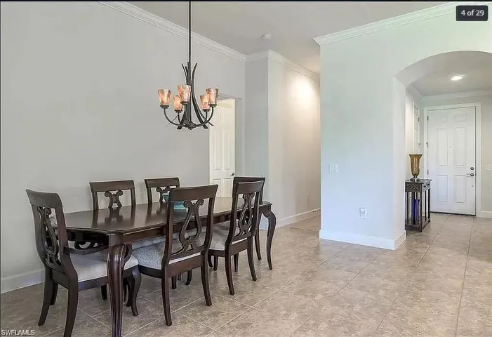 Spacious dining area with high ceilings and natural light, ideal for gatherings.