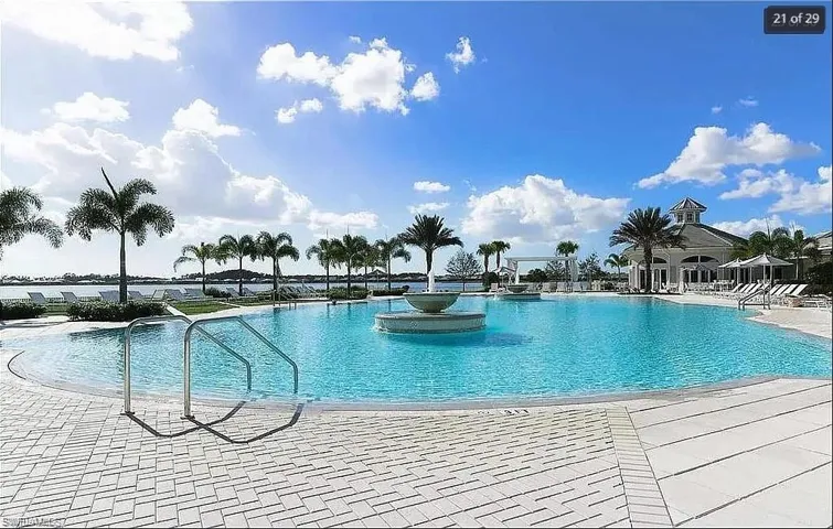 Resort-style pool with crystal-clear water and luxurious lounging areas.
