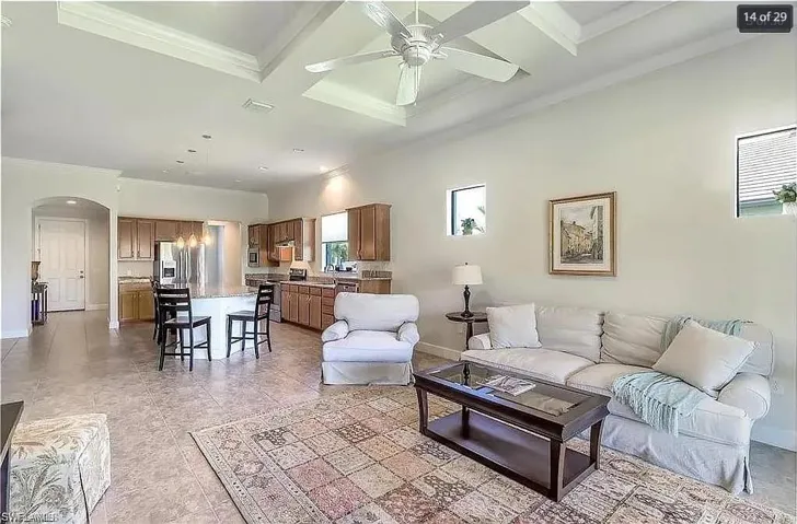 Expansive living space with a neutral palette and stylish architectural details.