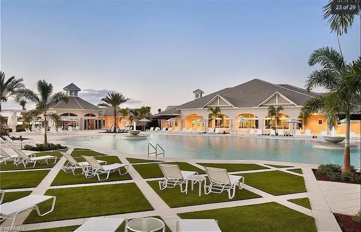 Evening view of the pool area, illuminated for a peaceful and inviting ambiance.