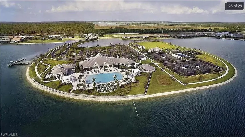 Scenic view of the clubhouse, pool, and walking paths from above.