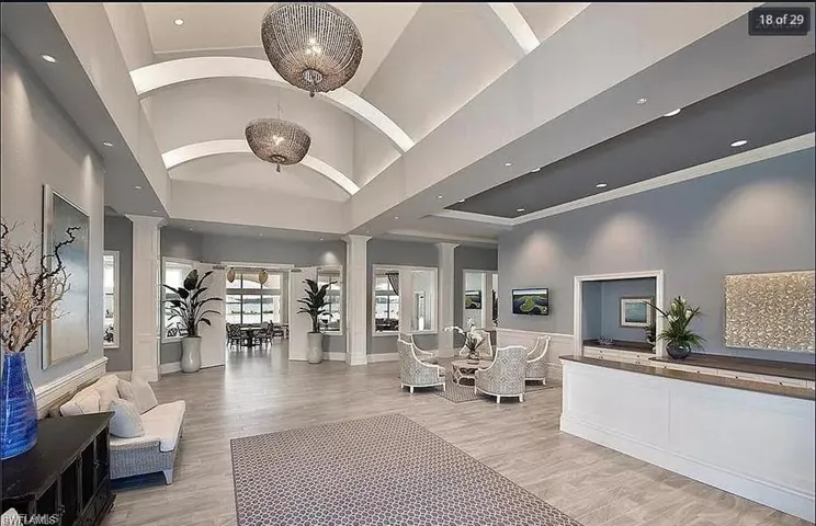 Elegant clubhouse lobby with high ceilings and stylish furnishings for social gatherings.
