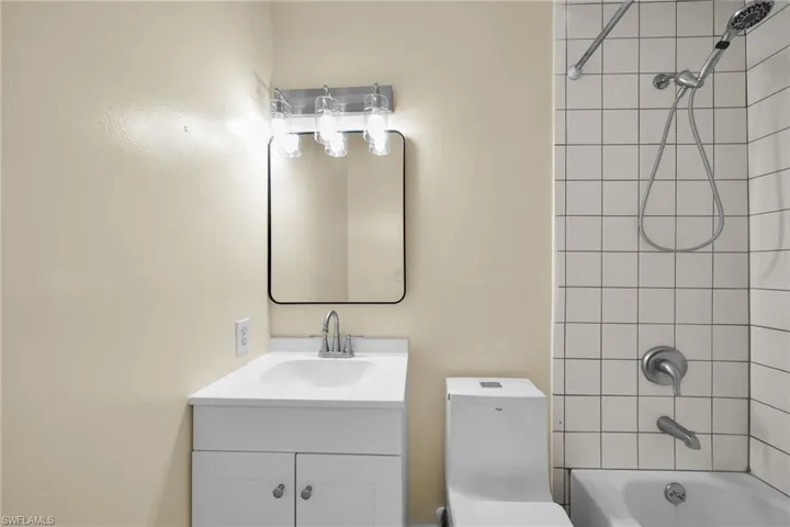 Full bathroom with vanity and shower / washtub combination