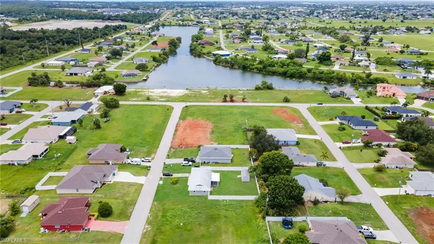 View of property location featuring nearby suburban area and a large body of water