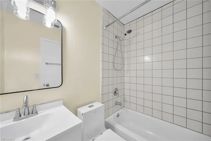 Full bathroom with bathtub / shower combination and vanity