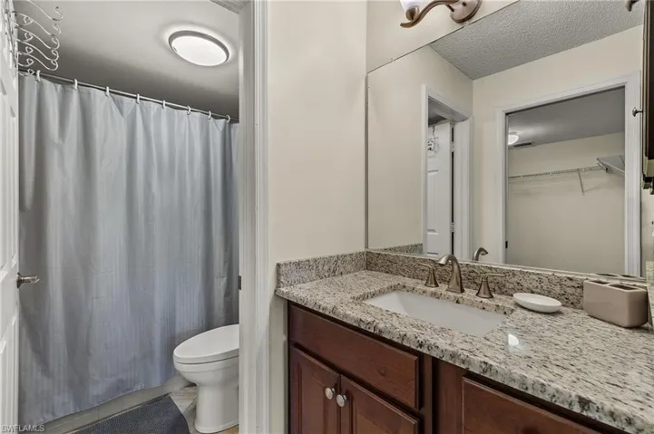 Bathroom featuring vanity, walk in shower