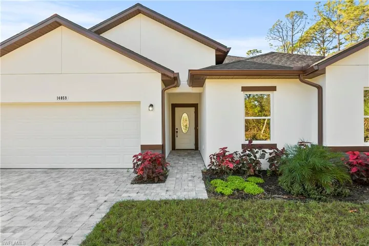 View of front of property with a garage