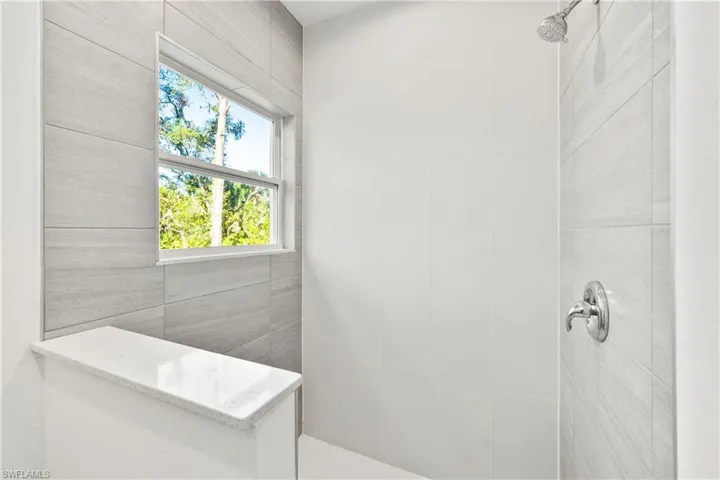 Bathroom with a tile shower